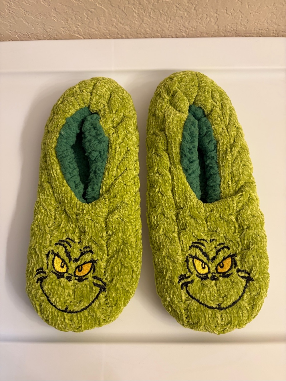 Dr. Seuss Grinch Green Plush Slip-On Slippers with Yellow Embroidered Face